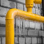 a plumber fixing a frozen gas line