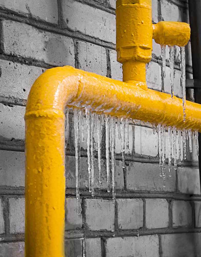 a plumber fixing a frozen gas line