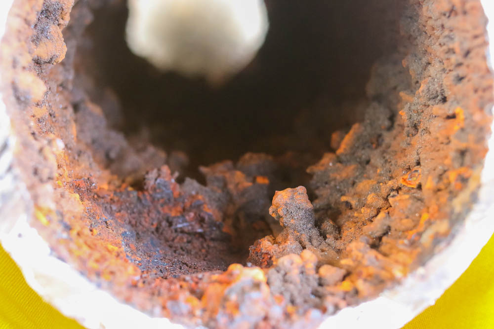 Cross-section view of inside a pipe with major buildup