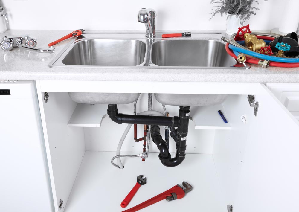 exposed kitchen plumbing